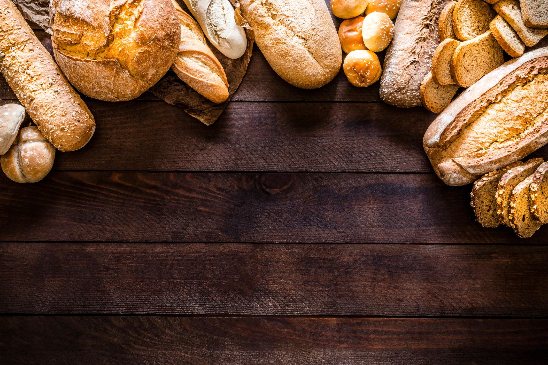 Assorted rustic breads on a wooden table