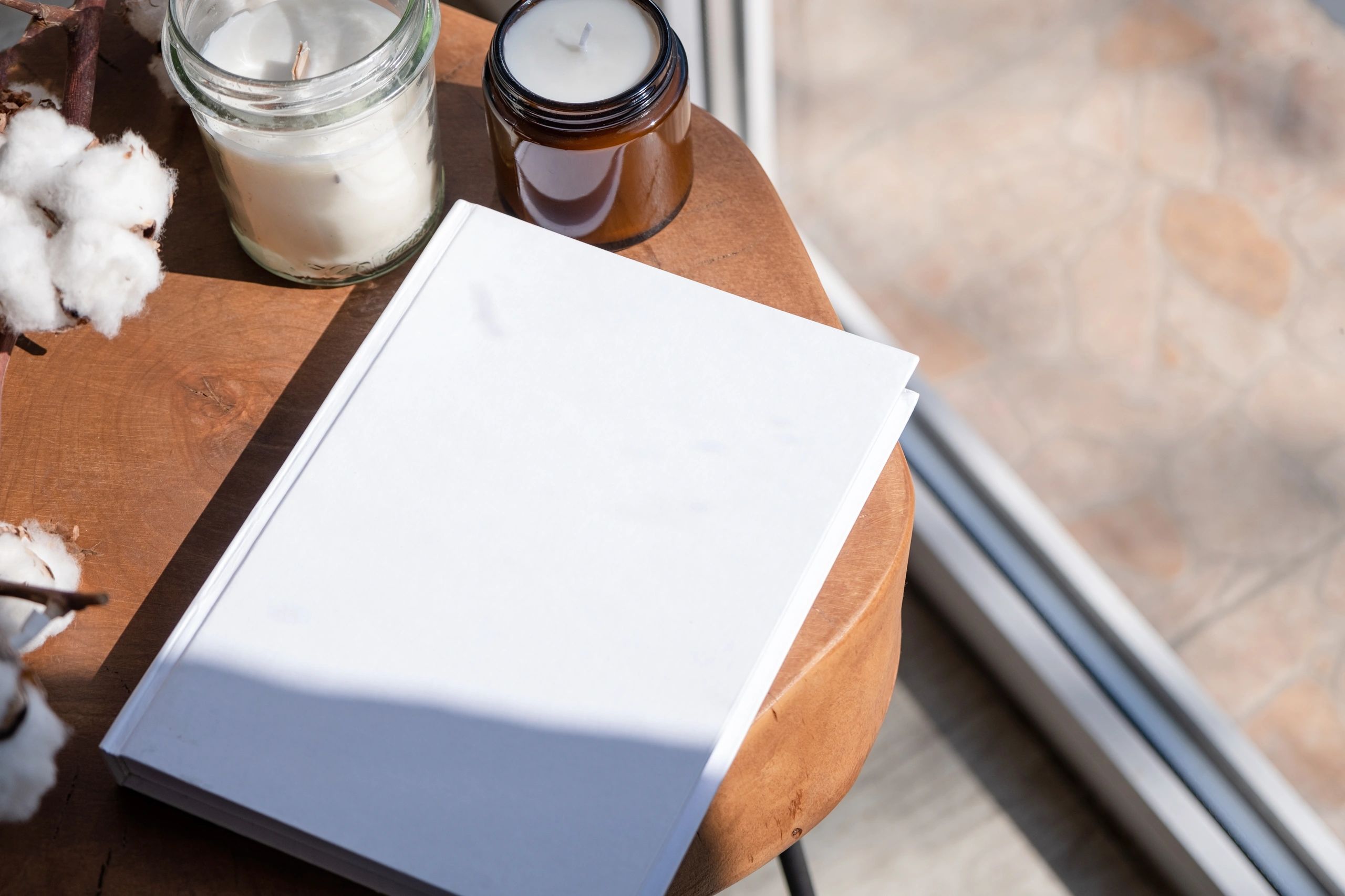 Natural-style desk with paper and candle for journaling inspiration